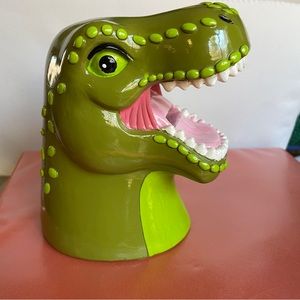 Dinosaur piggybank  large coin slot fits folded bills too.  Size in photos